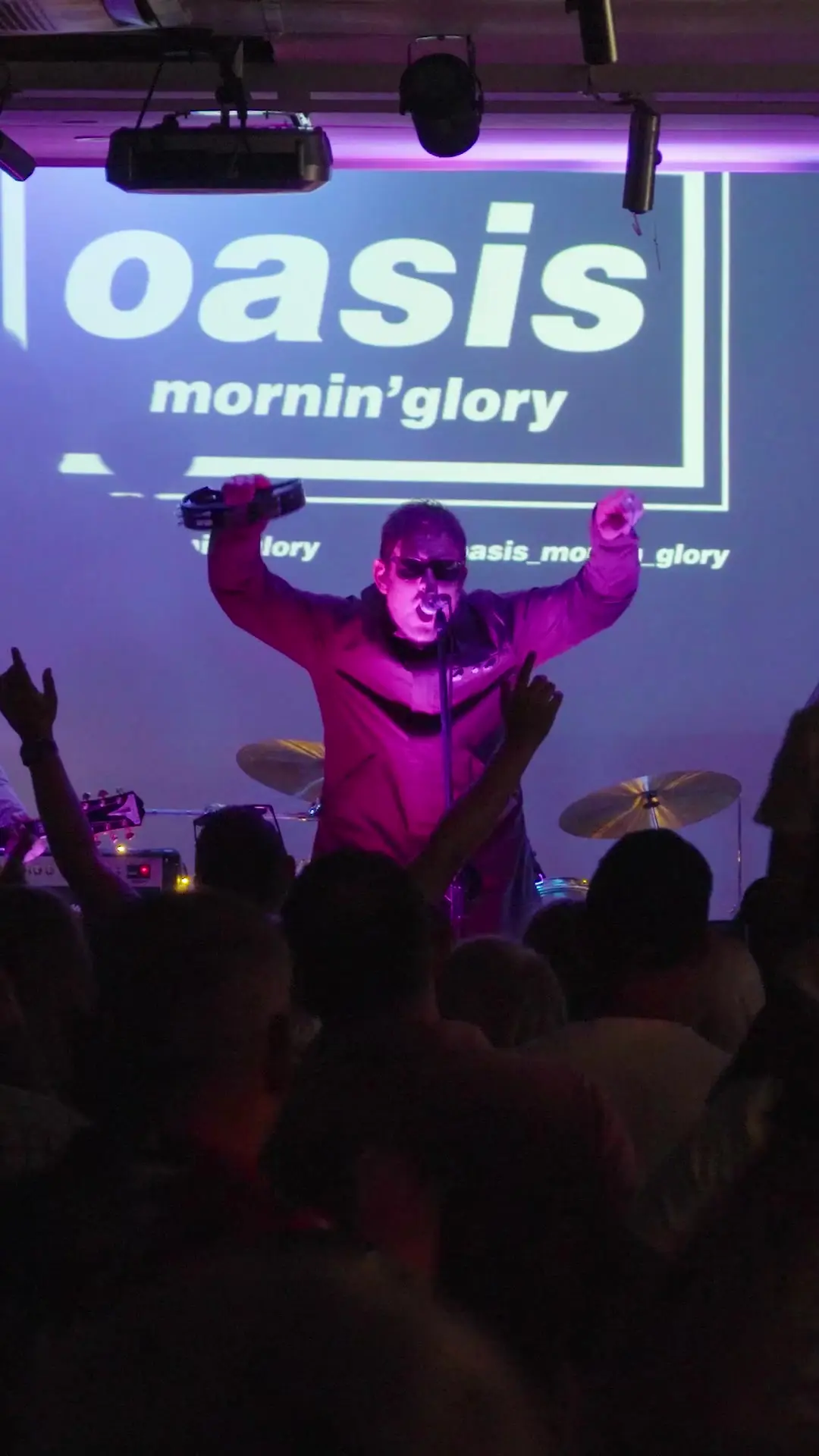 Frontman and crowd at the Roll With It finale